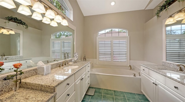 275 Royal Oak Way, Venice, FL 34292 - full bathroom with a bath, tile patterned flooring, and two vanities