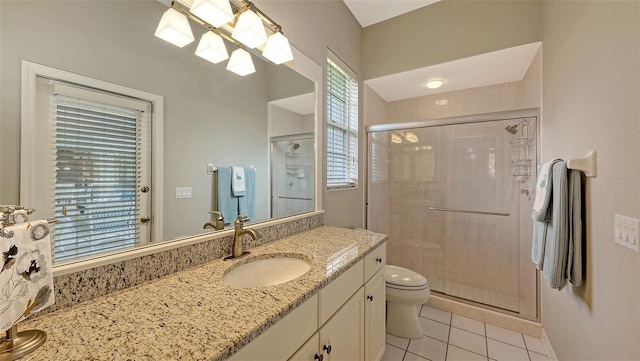 275 Royal Oak Way, Venice, FL 34292 - bathroom with a shower stall, vanity, tile patterned flooring, and healthy amount of natural light