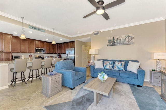 living room featuring crown molding, sink, light tile patterned flooring, and ceiling fan