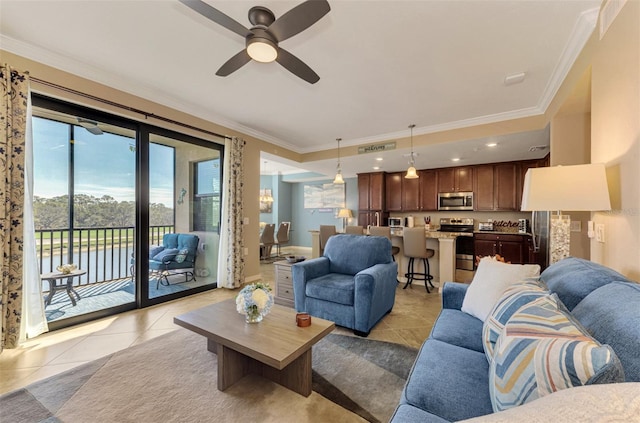 living room featuring light tile patterned floors, ceiling fan, and ornamental molding