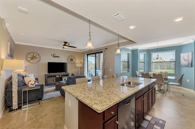 kitchen featuring dishwasher, ceiling fan with notable chandelier, sink, an island with sink, and decorative light fixtures