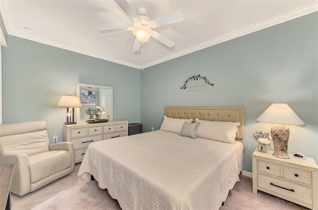 carpeted bedroom featuring ceiling fan and crown molding