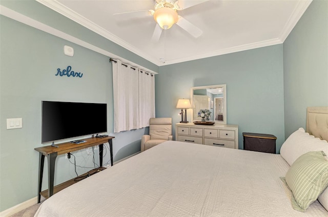 bedroom with ceiling fan, carpet floors, and ornamental molding