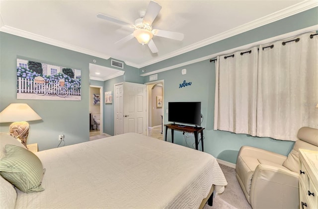 carpeted bedroom featuring ceiling fan and ornamental molding