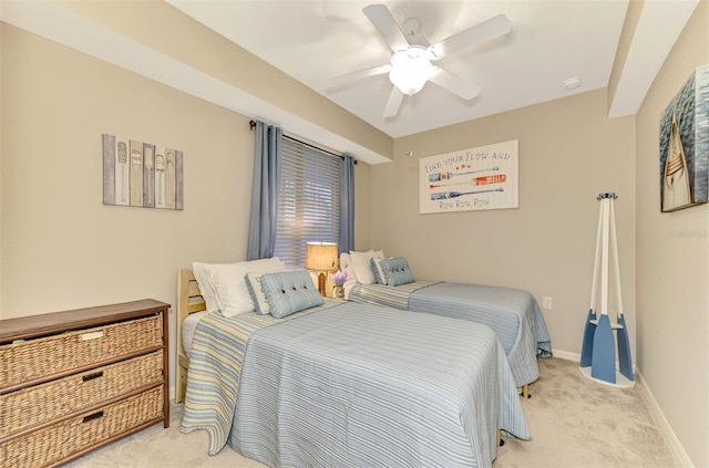 bedroom with ceiling fan and light carpet