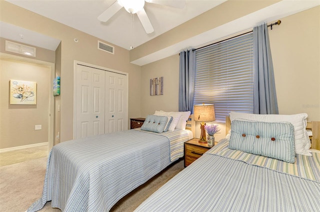 bedroom with carpet flooring, a closet, and ceiling fan