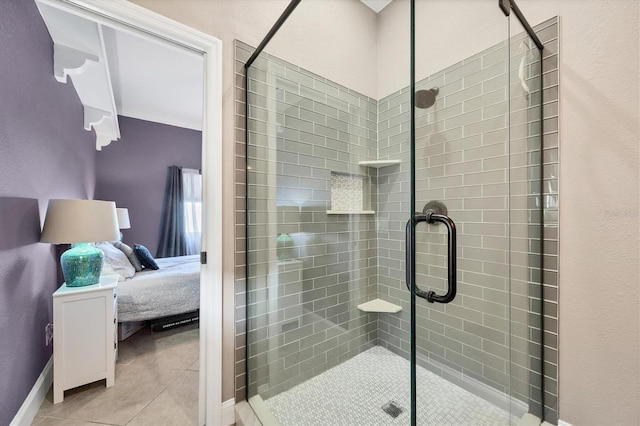 bathroom featuring an enclosed shower and tile patterned floors