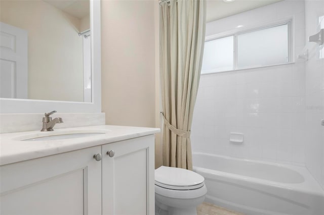 full bathroom with vanity, shower / bath combination with curtain, and toilet