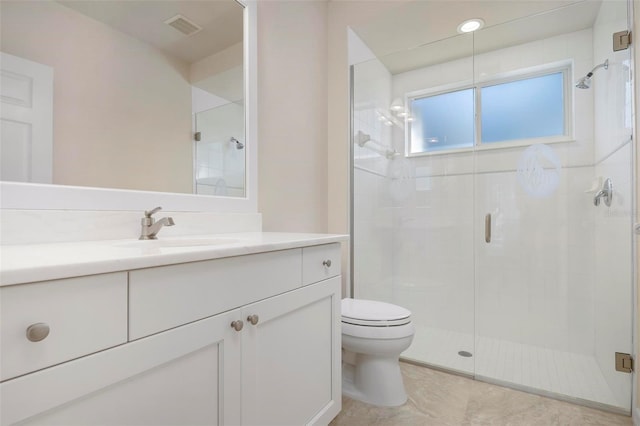 bathroom with walk in shower, tile patterned flooring, vanity, and toilet