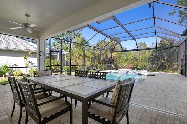 view of patio with glass enclosure and ceiling fan