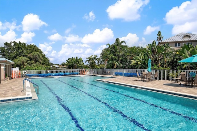 view of swimming pool featuring a patio area