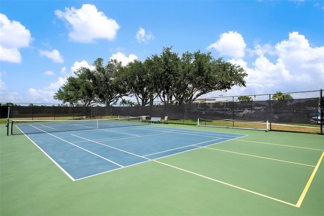 view of sport court with basketball hoop