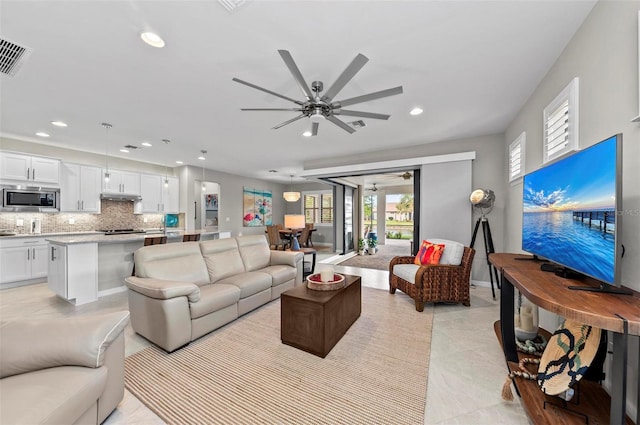 living room featuring ceiling fan