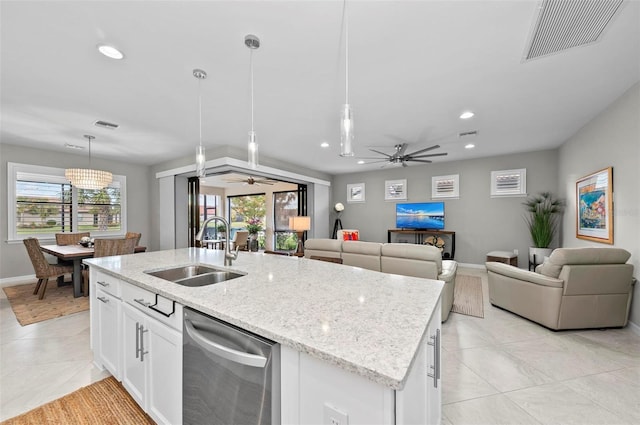 kitchen featuring dishwasher, white cabinetry, sink, and decorative light fixtures