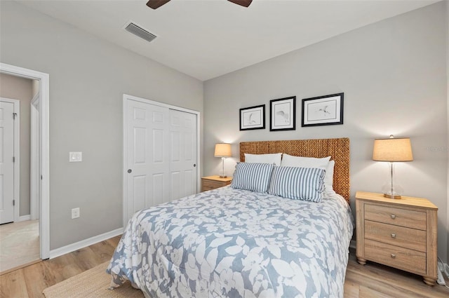 bedroom featuring ceiling fan, a closet, and light hardwood / wood-style floors