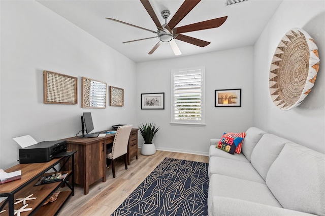 office space featuring ceiling fan and light hardwood / wood-style flooring