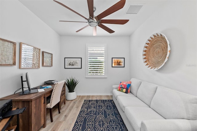 office space with light hardwood / wood-style flooring and ceiling fan