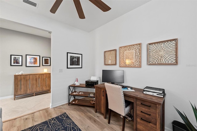 office space featuring light hardwood / wood-style floors and ceiling fan