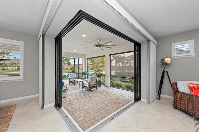 doorway with ceiling fan