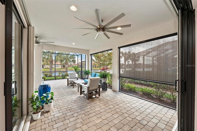 sunroom / solarium with ceiling fan