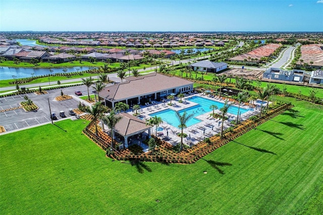 birds eye view of property with a water view