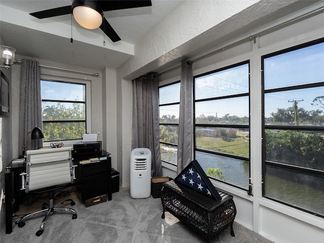 office space with ceiling fan and carpet floors