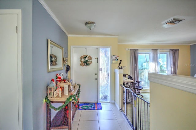 tiled entrance foyer with ornamental molding