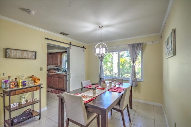 tiled dining space with a barn door, an inviting chandelier, ornamental molding, and sink