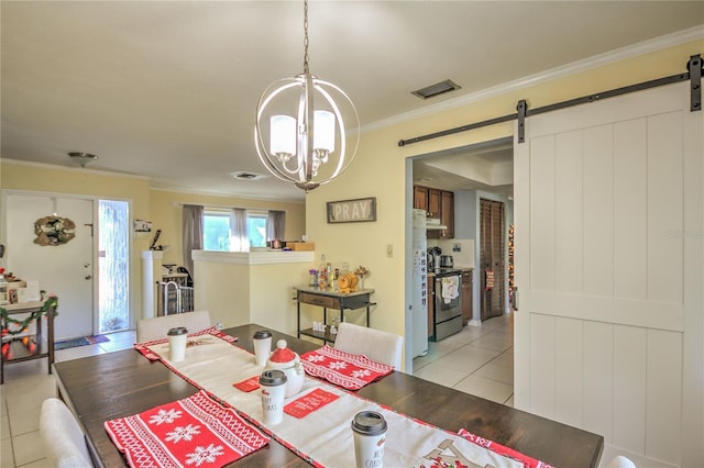 tiled dining room with a notable chandelier, a barn door, and crown molding