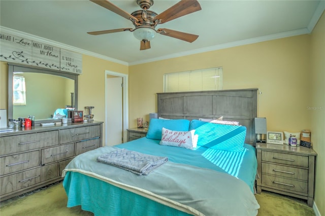 carpeted bedroom with ceiling fan and crown molding