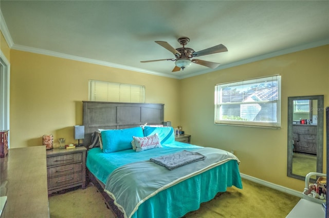 carpeted bedroom with ceiling fan and ornamental molding