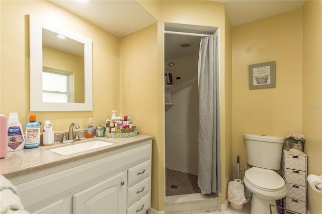 bathroom with a shower with shower curtain, vanity, toilet, and tile patterned flooring