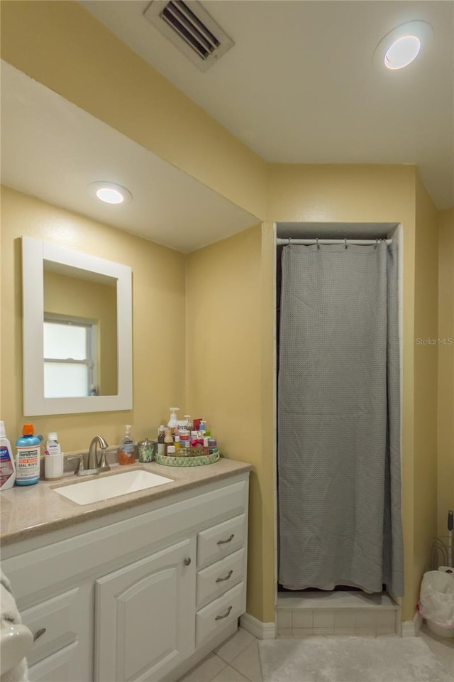 bathroom with tile patterned floors, vanity, and a shower with curtain