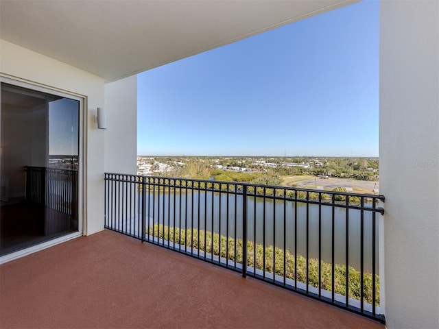 balcony featuring a water view