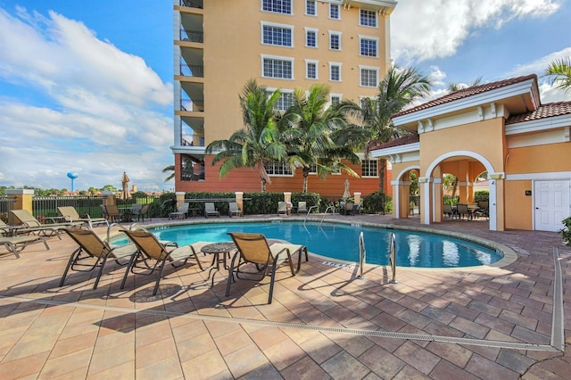 view of swimming pool with a patio area