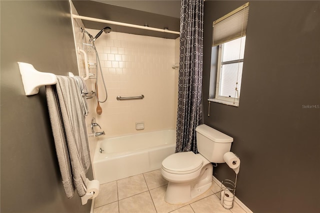 bathroom with tile patterned flooring, shower / bath combo, and toilet