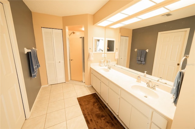 bathroom with tile patterned floors and vanity