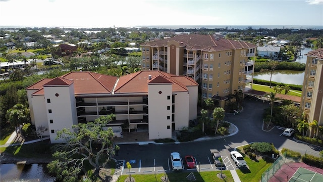 birds eye view of property with a water view