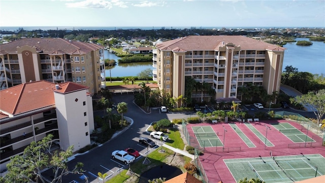 birds eye view of property featuring a water view