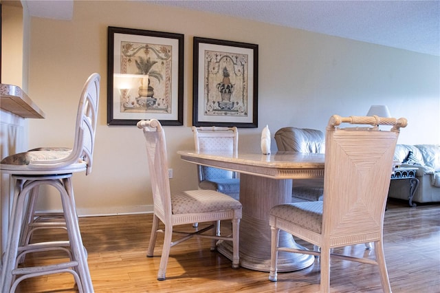 dining room with hardwood / wood-style flooring