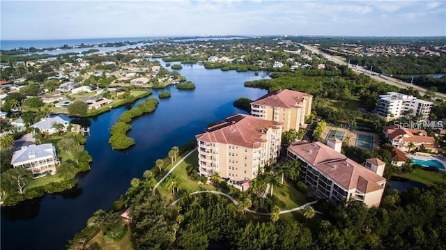 birds eye view of property with a water view