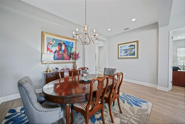 dining room with a chandelier, recessed lighting, visible vents, baseboards, and light wood finished floors