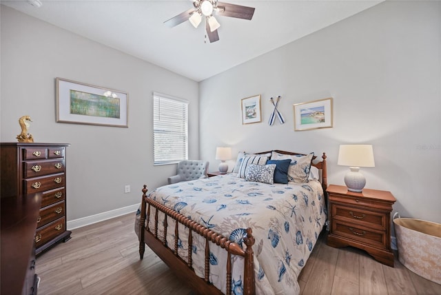 bedroom featuring light wood-style floors, ceiling fan, and baseboards