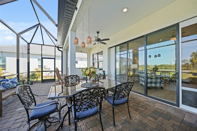 sunroom / solarium with ceiling fan