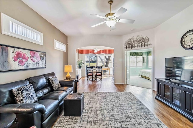 living room featuring hardwood / wood-style flooring and ceiling fan