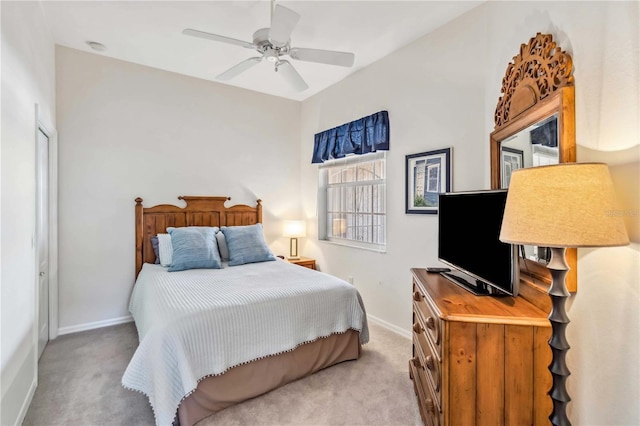 bedroom with ceiling fan and light colored carpet