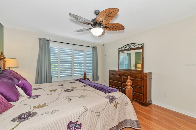 bedroom featuring wood-type flooring and ceiling fan