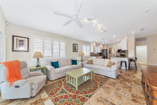 living room featuring ceiling fan