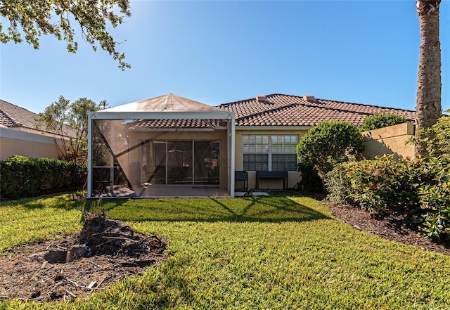 back of house featuring a yard