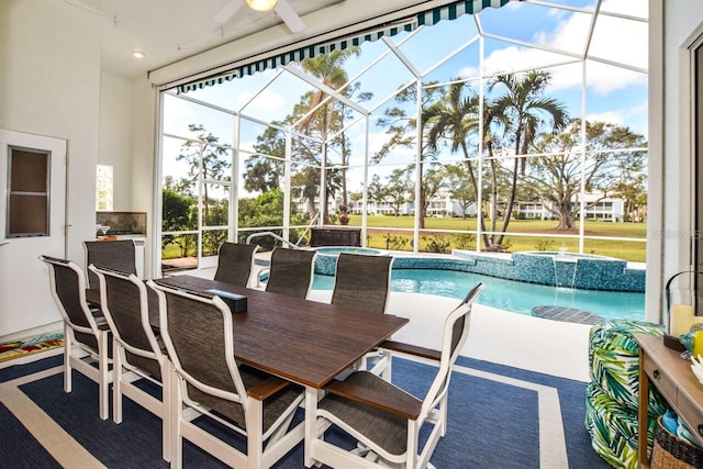 sunroom featuring a swimming pool and ceiling fan